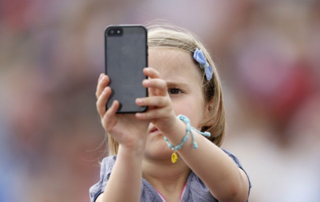 child-using-phone-reuters
