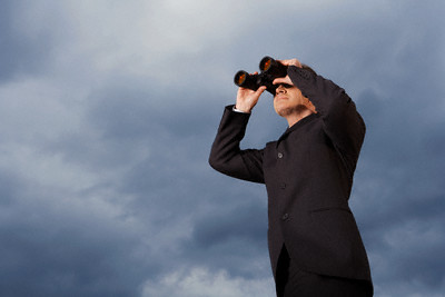 Businessman Looking Through Binoculars --- Image by © moodboard/Corbis
